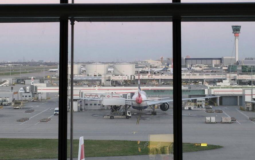 Airport runway with planes at gates, representing CBSA airport postings
