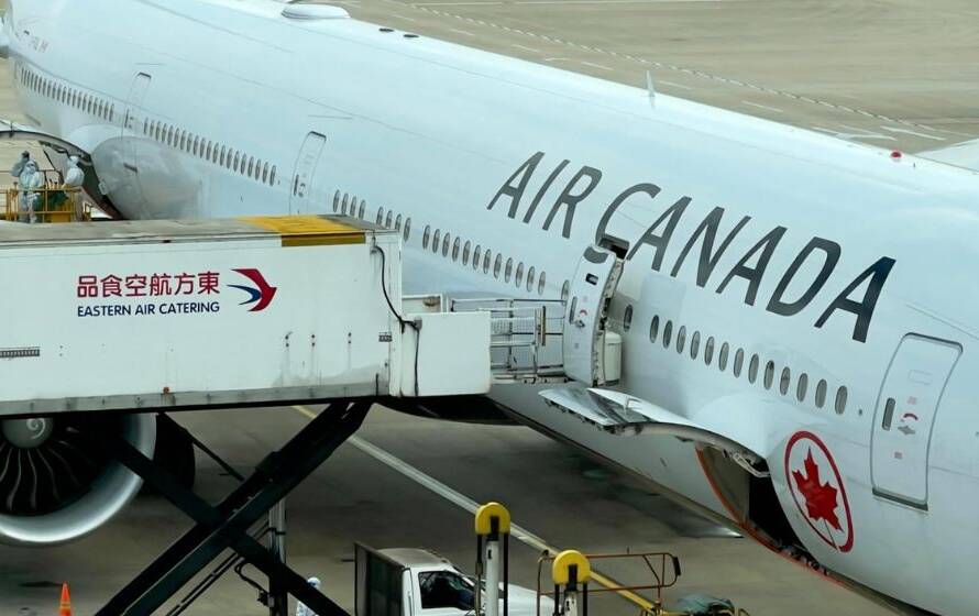 Air Canada aircraft parked at an international airport gate while ground crews service the aircraft, representing international travel, passenger screening, cargo movement, and border security operations.