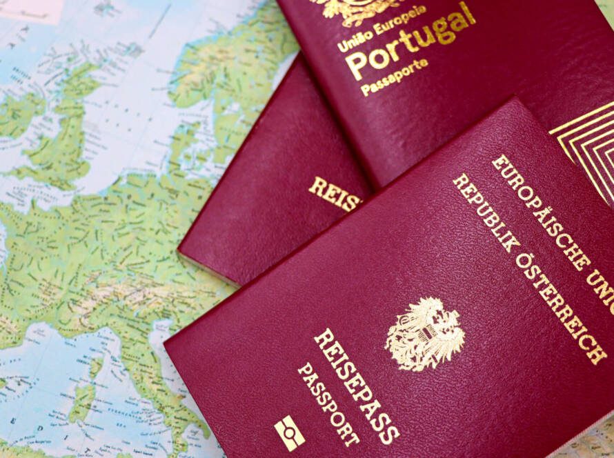 CBSA NEXUS Program, NEXUS program guide - Close-up of European passports from Portugal and Austria on a world map