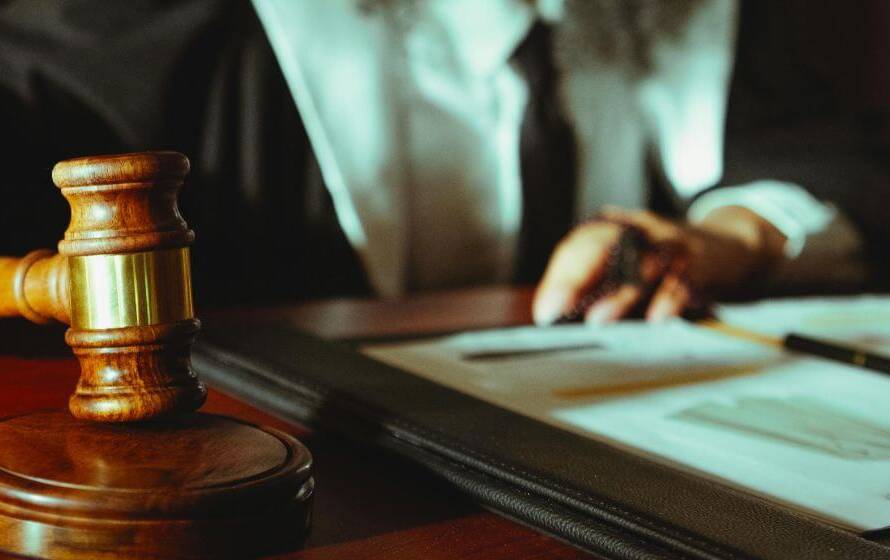 Judge’s gavel on desk symbolizing legal authority and enforcement powers of CBSA officers