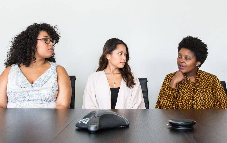 A diverse group of professionals participating in a meeting, representing workplace diversity, inclusion, and employment equity initiatives within the Canada Border Services Agency.
